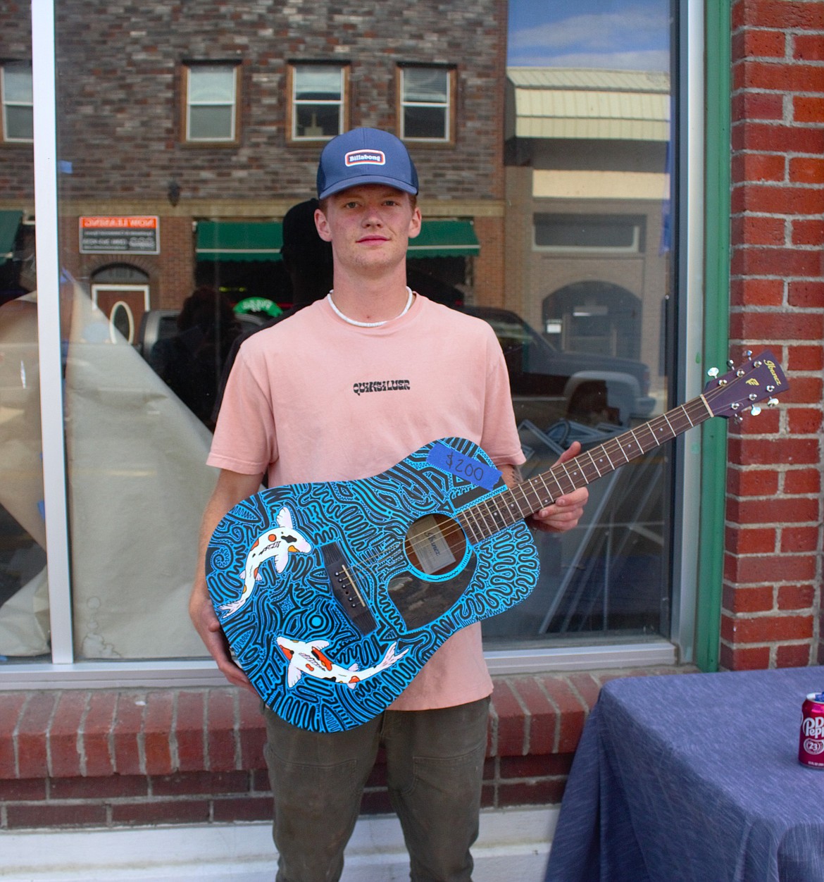 Eli Newell with his painted guitar, which sold at the BFHS Art Show on May 21.