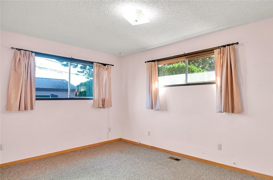 The before: When Managing Editor R. Hans "Rob" Miller first moved into his home, the primary bedroom was pink, including the curtains.