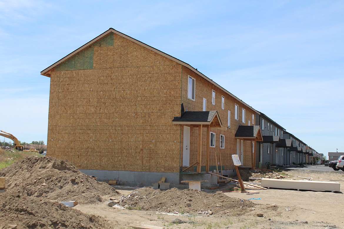 Multifamily housing under construction in Moses Lake. A report from the Department of Commerce included a list of suggestions for alleviating the state’s housing shortage.