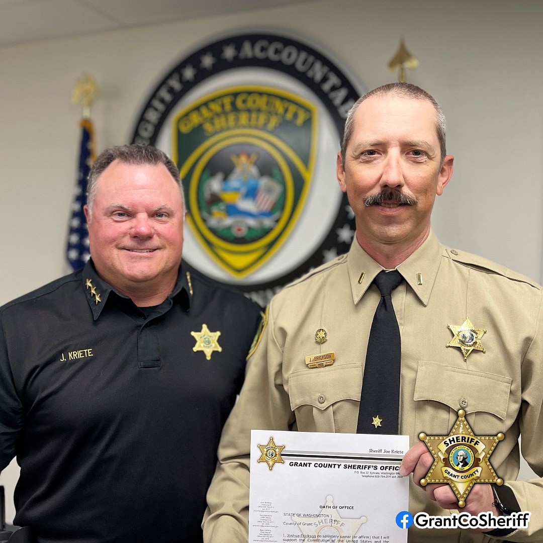 Sheriff Joey Kriete, left, administered the oath of office to Lieutenant Josh Erickson, right, May 29. The ceremony was attended by family, friends and colleagues.
