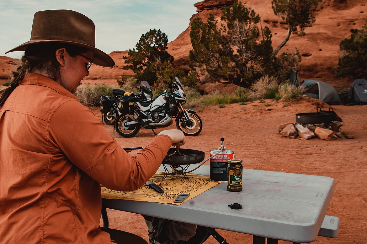 Amanda Zito cooks a meal while motorcycle camping. (Photo courtesy of Amanda Zito)