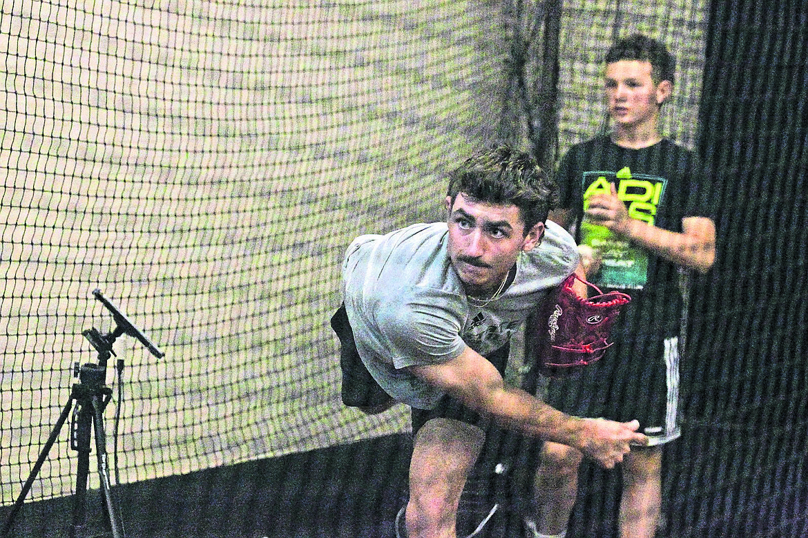 JASON ELLIOTT/Press
Bryce Stockton, a former Coeur d'Alene High pitcher now at Sacramento State, throws a pitch at the First and Third Indoor Baseball/Softball Facility in Hayden.