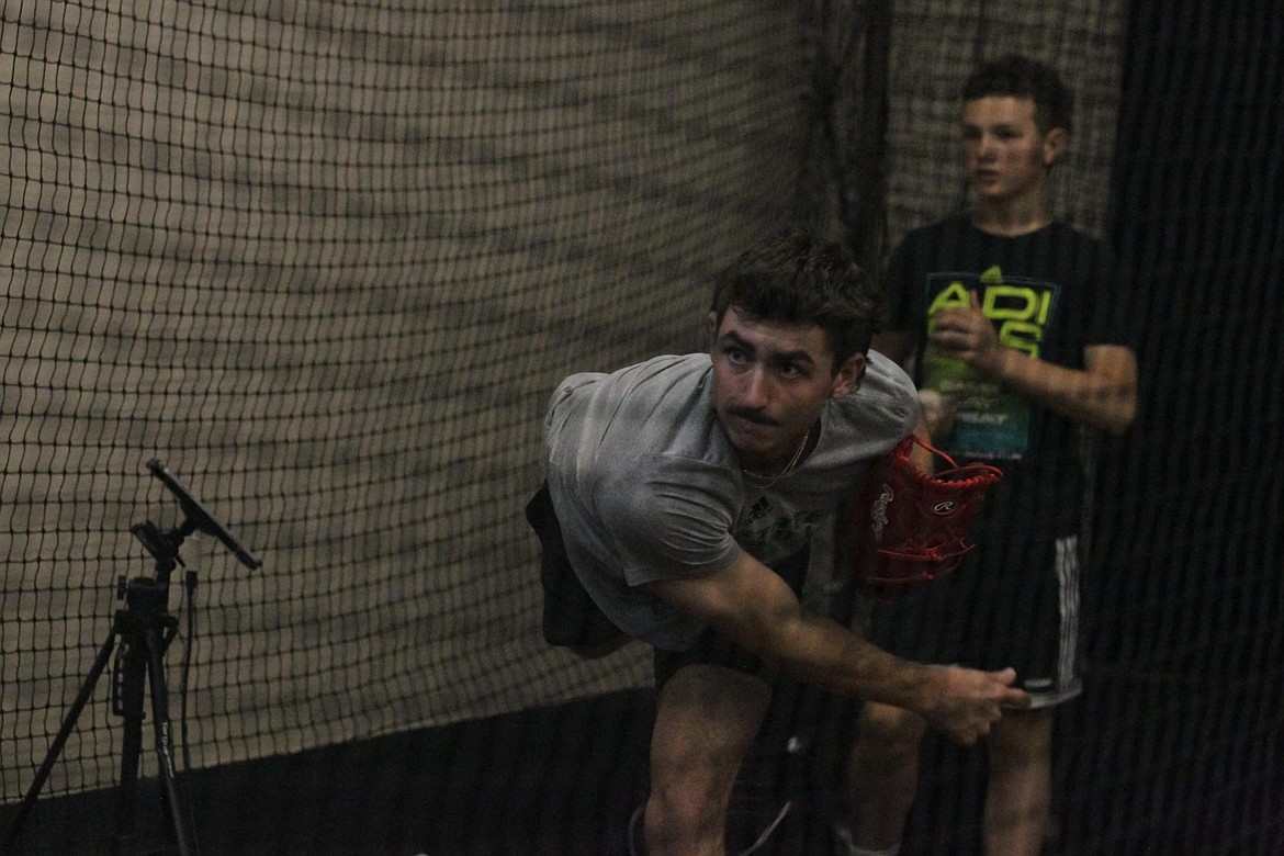 JASON ELLIOTT/Press
Bryce Stockton, a former Coeur d'Alene High pitcher now at Sacramento State, throws a pitch at the First and Third Indoor Baseball/Softball facility in Hayden.