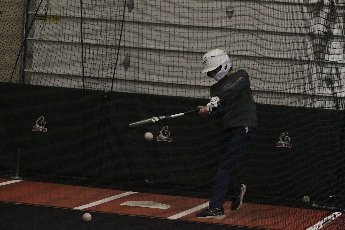 JASON ELLIOTT/Press
Lars Bazler takes a swing in a batting cage at the First and Third Indoor Baseball//Softball Facility in Hayden.