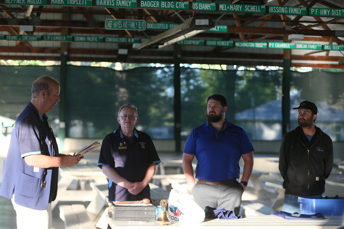 From left, Post Falls Lions secretary Ted Macaulay and President Larry Luther swear in new members Chris Brown and Carlos Martinez during a ceremony Wednesday.