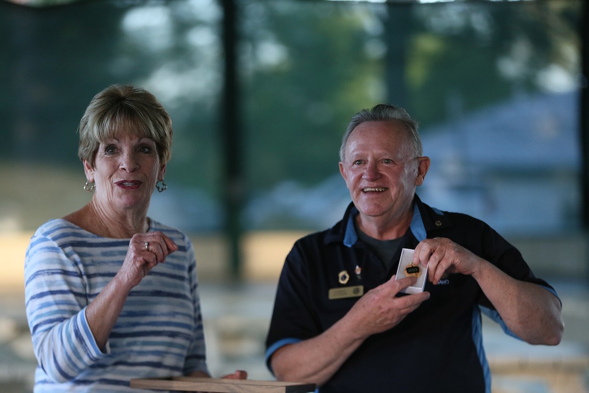 Janice Macaulay is presented Wednesday with a gift from Post Falls Lions President Larry Luther for baking cookies for meetings and helping with the 2023 Post Falls Lions Brewfest.