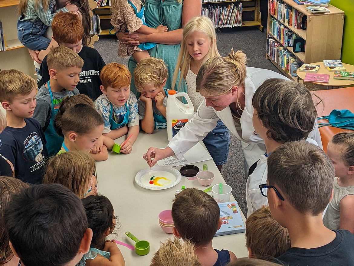 Children watch a STEAM experiment during a Summer Experience workshop at the library. (Photo courtesy of Lune Axelsen)