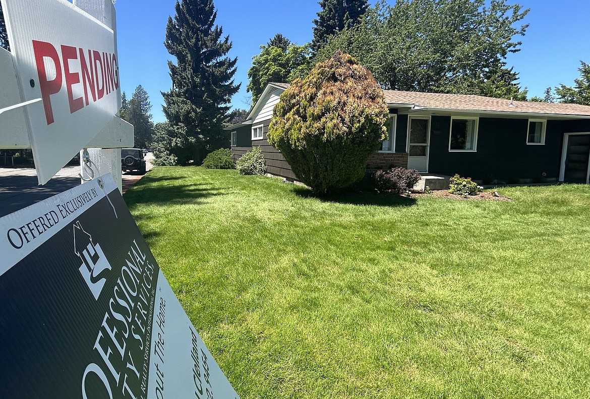 A Coeur d'Alene home for sale has a pending sign in front of it on Friday.