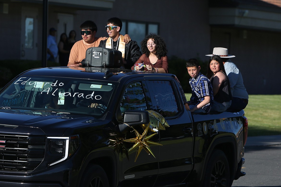 Before Friday’s graduation ceremony, graduates paraded through the streets of Royal City in decorated vehicles bearing the school’s colors.