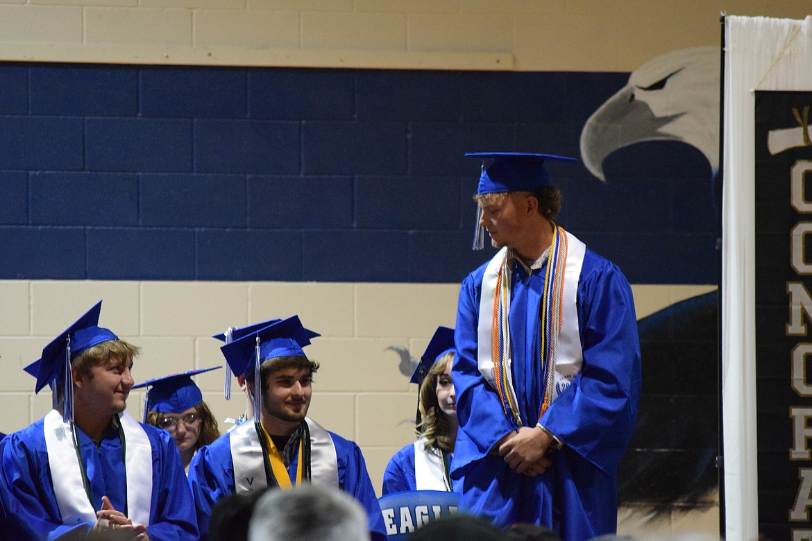 Soap Lake graduates share a moment on stage during the June 1 ceremony honoring their accomplishments.