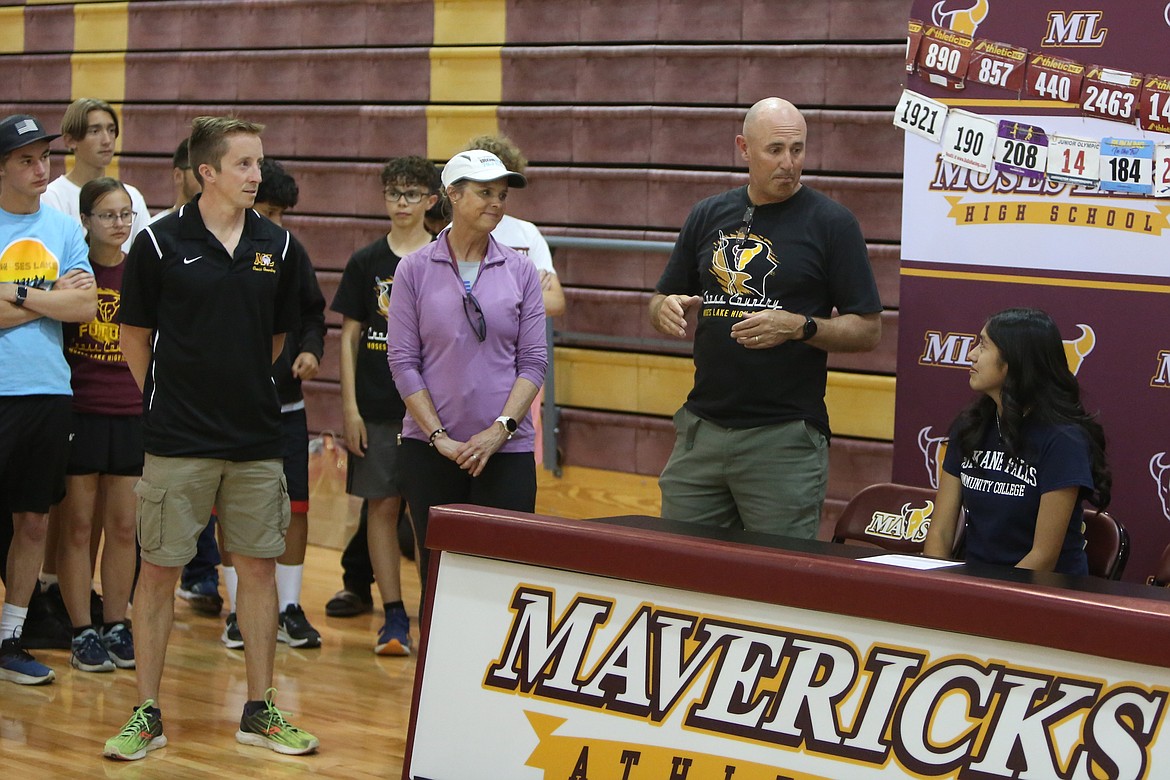 Moses Lake cross country Head Coach Larry Dagnon, center right, speaks highly of Maverick senior Ambar Salas Tepale, right, during Thursday’s signing ceremony.