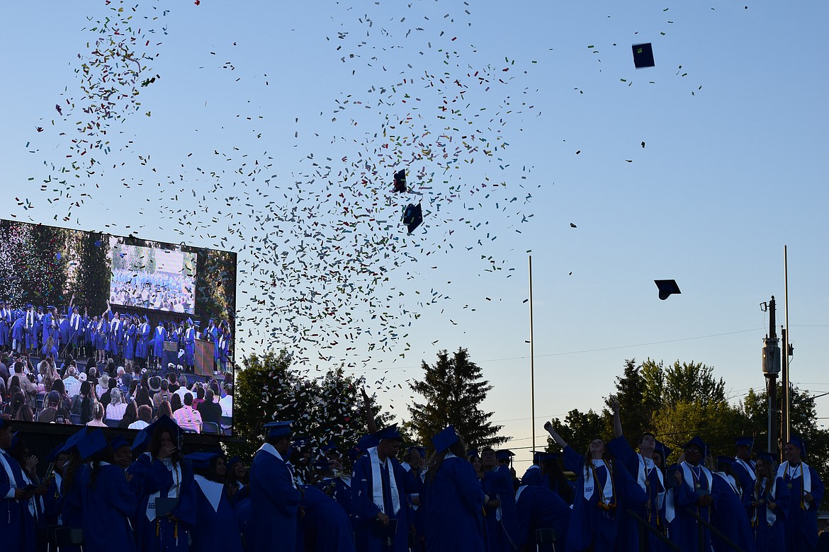 Hats and confetti fly as the 2024 Warden High commencement ceremony concludes.