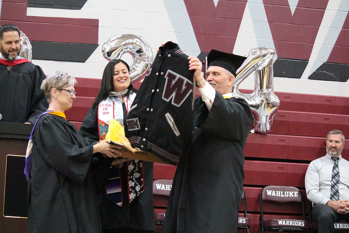 Guest of Honor Matt Watrus got a special gift, his own Wahluke High School jacket, in recognition of his years helping students.