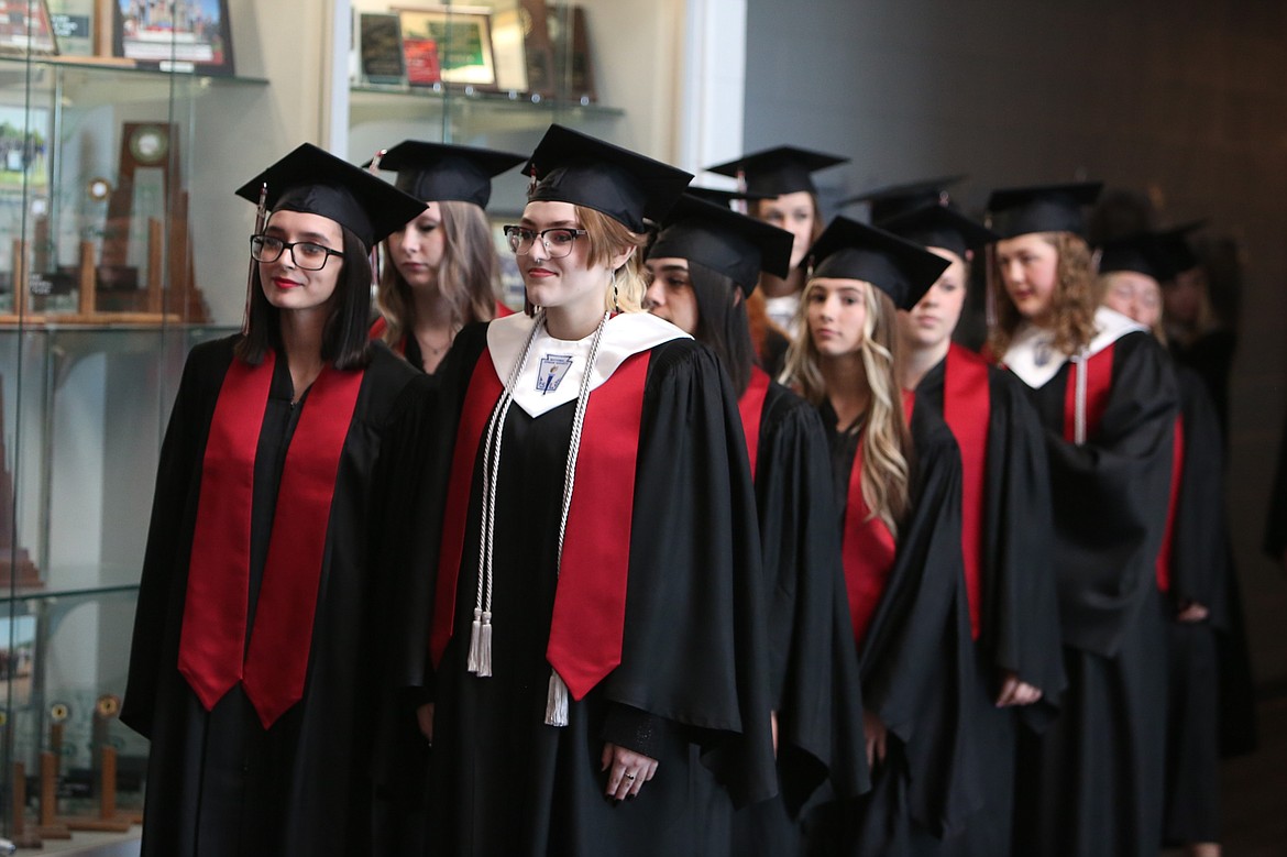 Almira/Coulee-Hartline seniors line up two-by-two for the processional to begin Saturday’s graduation ceremony.