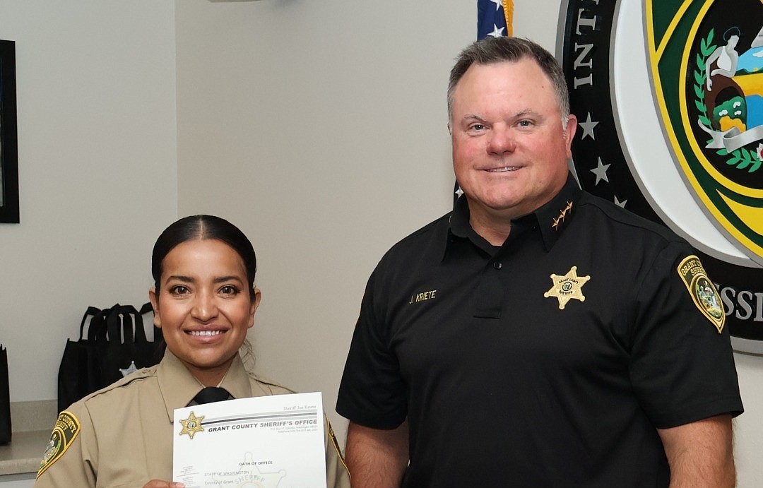 Sheriff Joey Kriete, right, swore in Corrections Corporal Li Ramirez Monday morning.