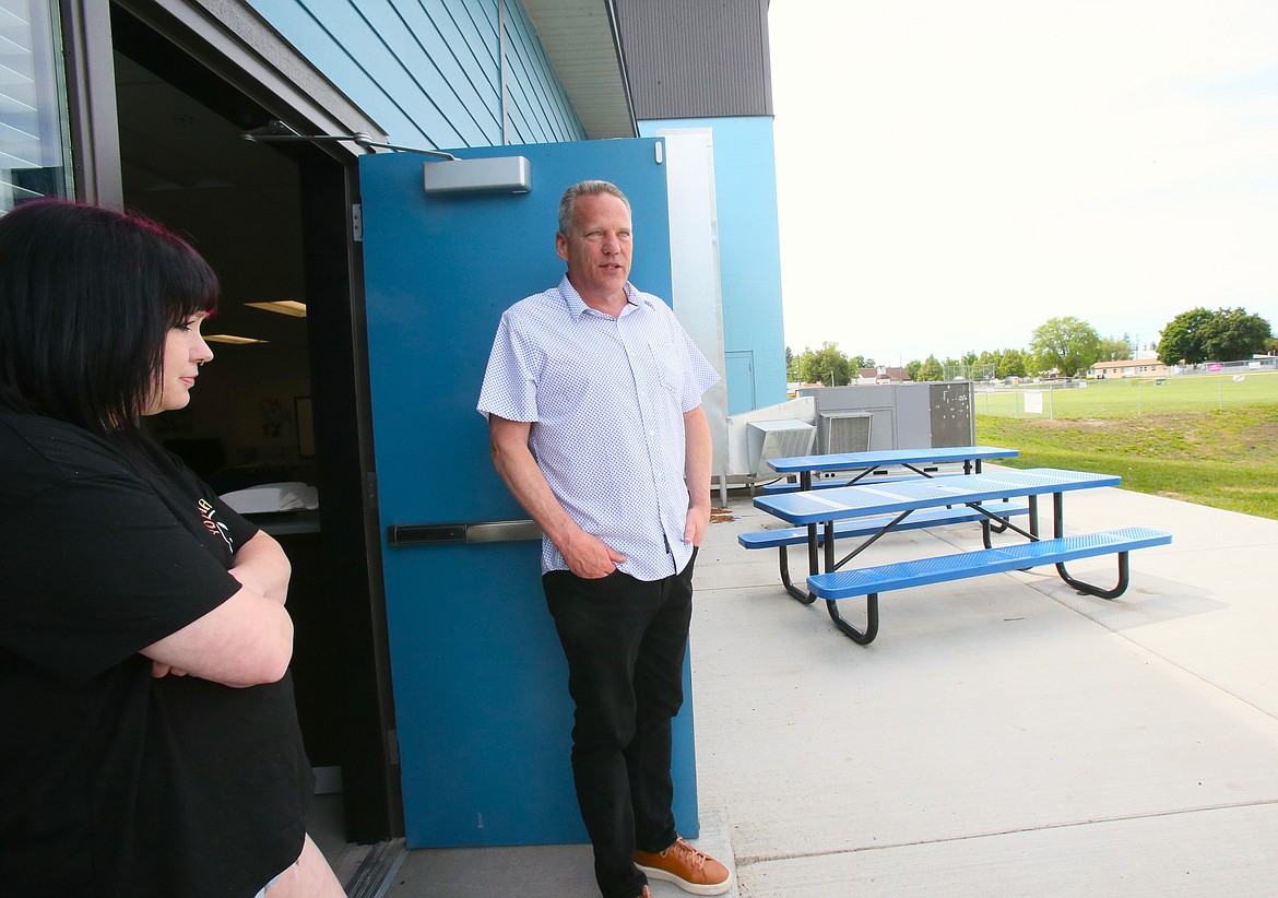 Boys and Girls Club of Kootenai County Executive Director Mark Kuhnhausen and 
Jordan Johnson Clubhouse Director Natasha Malgren step out to the teen patio Thursday while showing what work was done at the Post Falls site during the recently completed $1.7 million expansion.