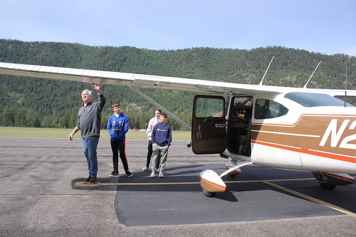 The pilots had the students accompany them as they did a pre-flight walk around explaining the different functions of the aircraft.