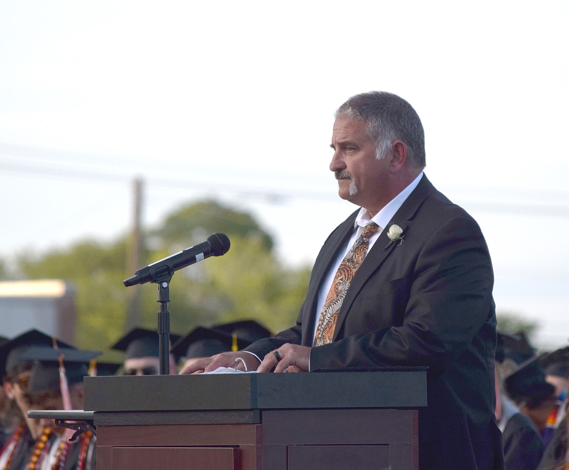 Ephrata High School Principal Aaron Cummings speaks during the graduation ceremony – for the last time as principal. Students had him “graduate” with them by gifting him a cap and gown and congratulating him for becoming the Ephrata School District’s new Assistant Superintendent.