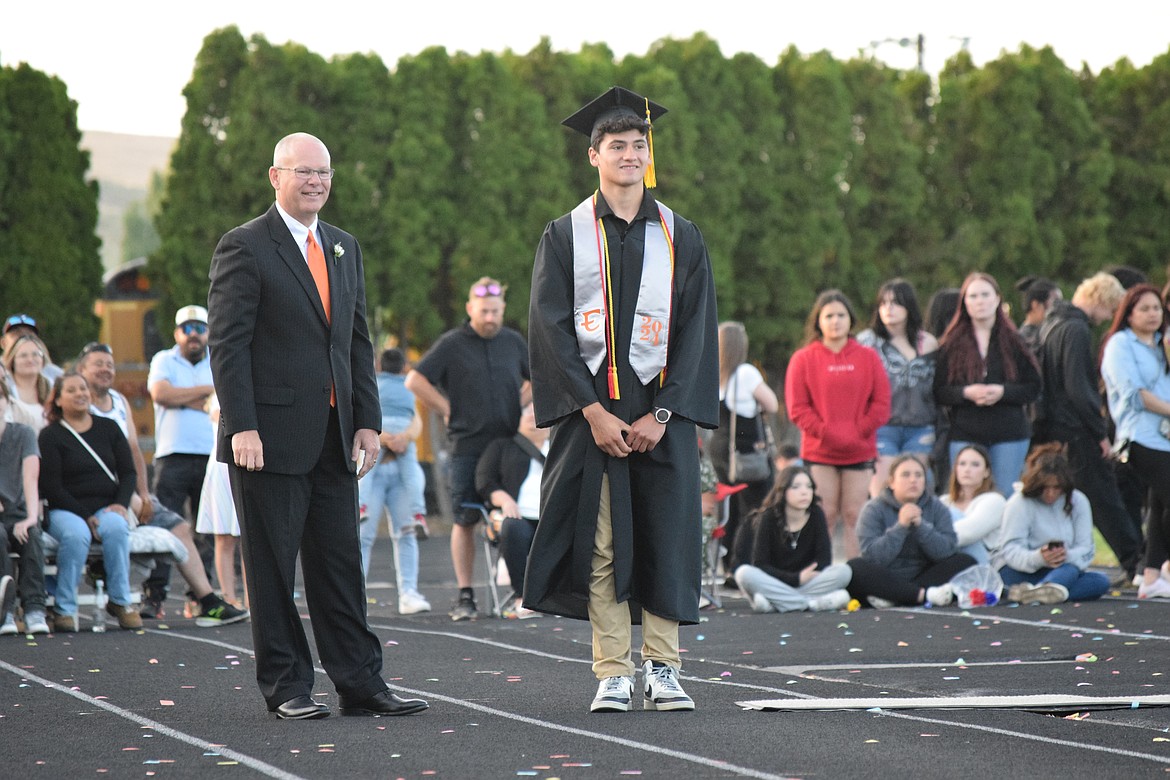 Ephrata School District Superintendent Tim Payne smiles as a student walks to collect a diploma. This is Payne’s last EHS graduation as superintendent and he passed out handshakes and congratulations proudly.