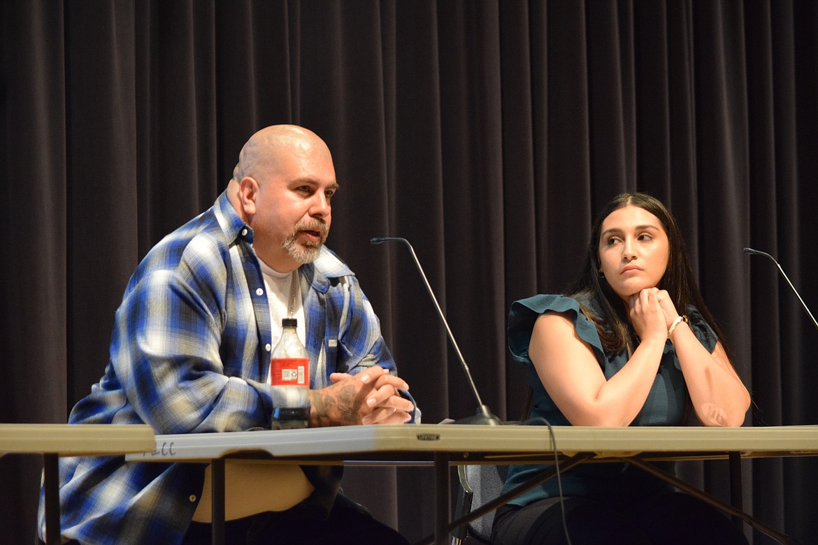 Recovery coach Victor Estrada, left, speaks about his personal experience with gangs during the Moses Lake Community Coalition’s gang prevention town hall event Thursday evening.