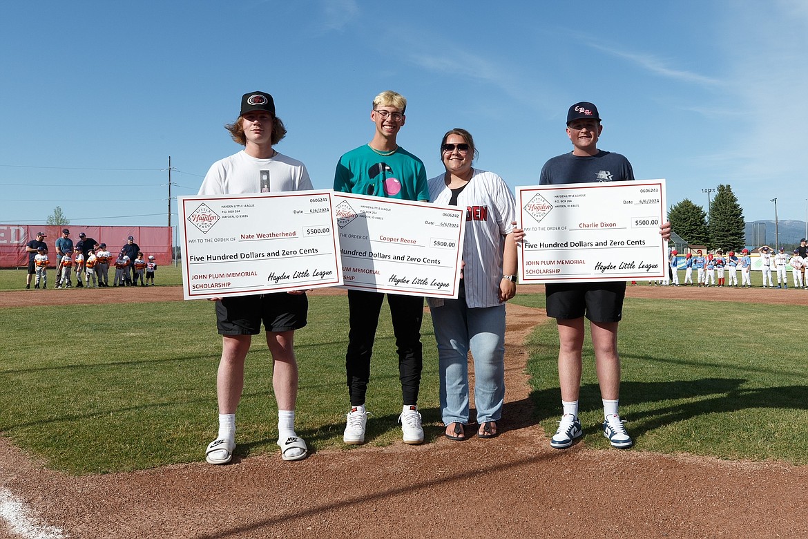 JASON DUCHOW PHOTOGRAPHY
Last Thursday, Hayden Little League celebrated the end of the season with championship games, raffle prizes, a barbecue and awards. Three Lake City High School seniors were awarded the John Plum Memorial Scholarship. These three seniors are all former Hayden Little League baseball players and will play in college next year. From left are Nate Weatherhead, Community Colleges of Spokane; Cooper Reese, New Mexico State; Mariah Martindale, Little League District 1 Administrator, and Charlie Dixon, Boise State (club team).