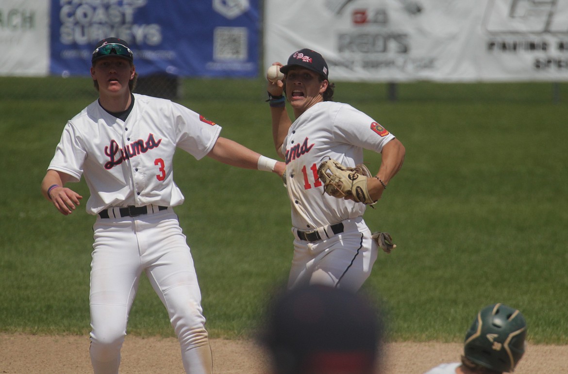 MARK NELKE/Press
Coeur d'Alene Lumbermen second baseman Ty Shepard (11) throws on to first base after forcing out Bodee Thivierge of Lewis-Clark, as Lums shortstop Travis Usdrowski (3) looks on during the first game Monday at Thorco Field.