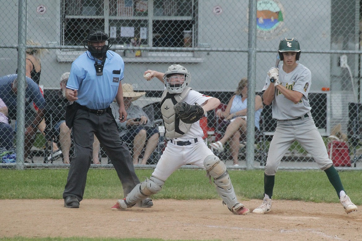 MARK NELKE/Press
Coeur d'Alene Lumbermen catcher Chase Saunders throws to second on a steal attempt vs. Lewis-Clark in the first game Monday at Thorco Field.