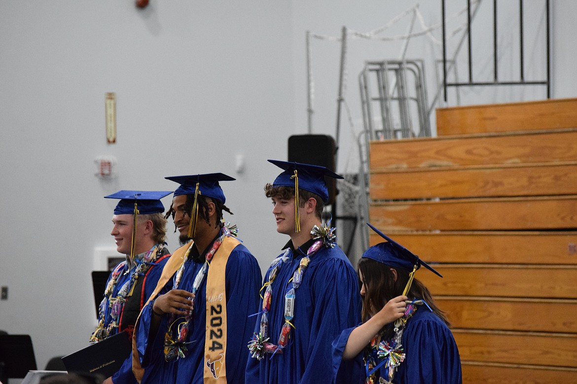 The Moses Lake Christian Academy Class of 2024 finishes moving their tassels after collecting their diplomas. Three are moving on to college while a fourth has opted to join the U.S. Marine Corps.