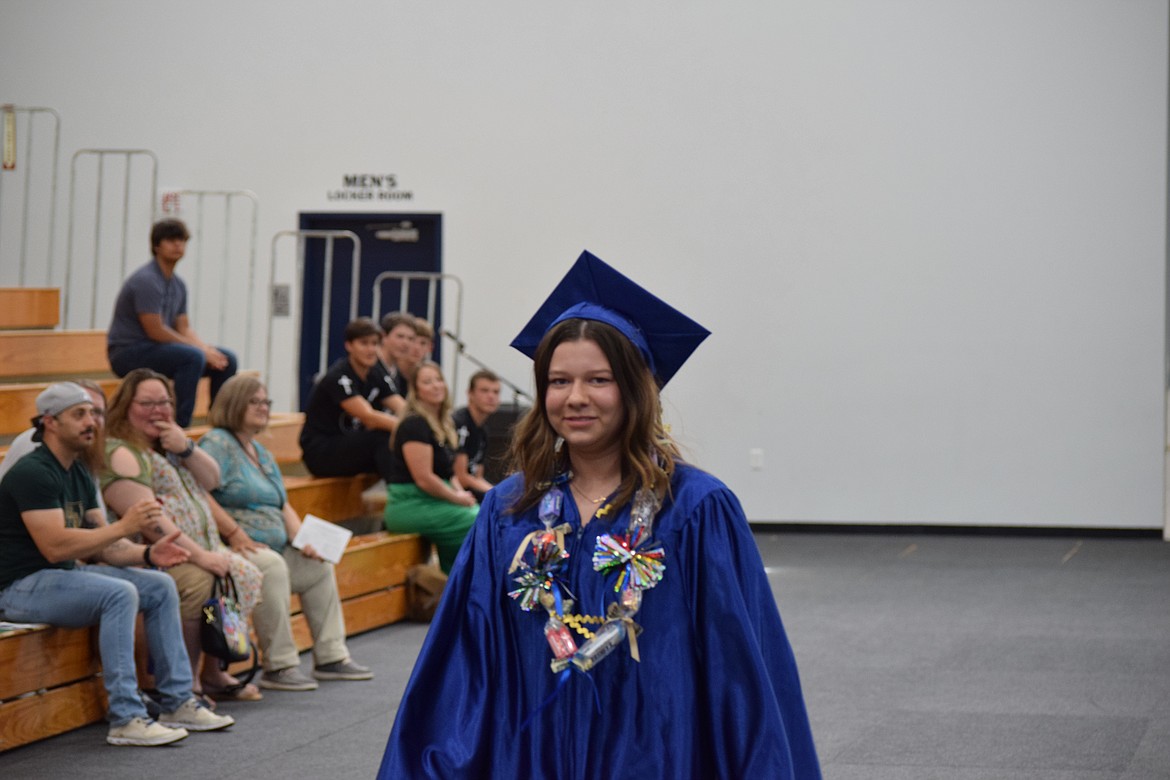 Maria Lynch exits the gym after accepting her diploma. Her next step is Big Bend Community College.