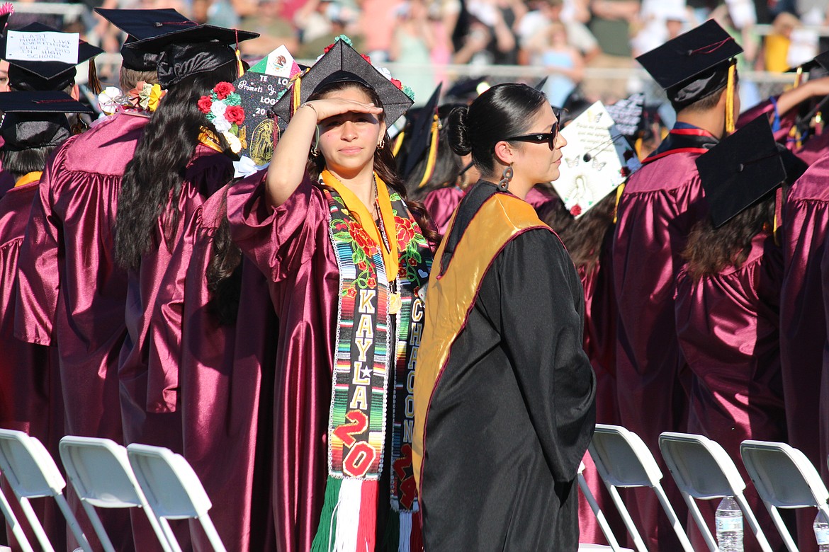 An MLHS senior looks for family in the stands as the class of 2024 walks in for graduation ceremonies May 31.