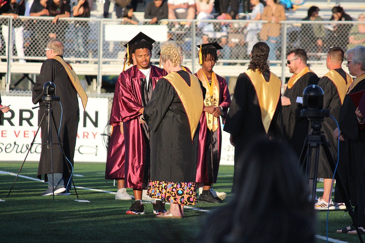 A Moses Lake senior receives his diploma.