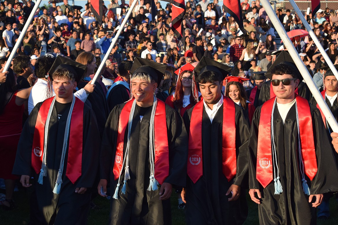 Othello High School seniors lead the procession on the OHS field during Friday evening’s graduation celebration.