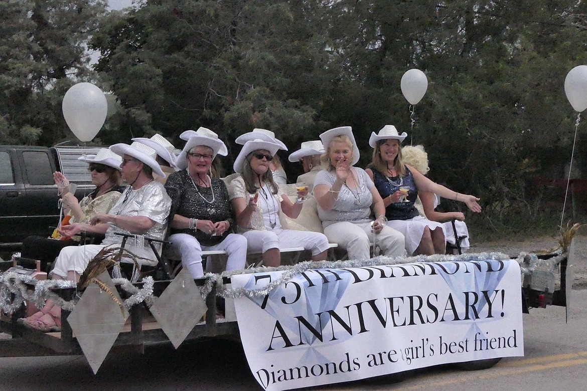 Hot Springs ladies celebrate the 75th anniversary of the Homesteader Days event with a "Diamonds are a Girl's Best Friend" float in honor of the event's longevity.  (Chuck Bandel/VP-MI)