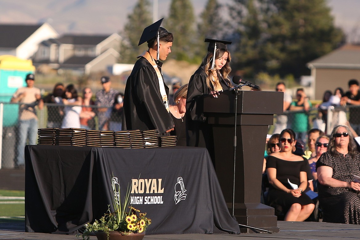 Royal High School Senior Class President Nickole Rodriguez, right, and Senior Class Treasurer Luis Deras, left, give their speeches as class speakers at Friday’s graduation ceremony.