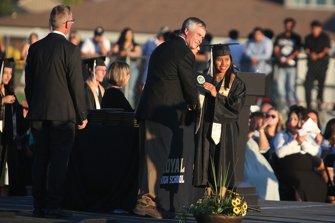 A Royal High School graduate smiles for a photo at Friday’s graduation ceremony.