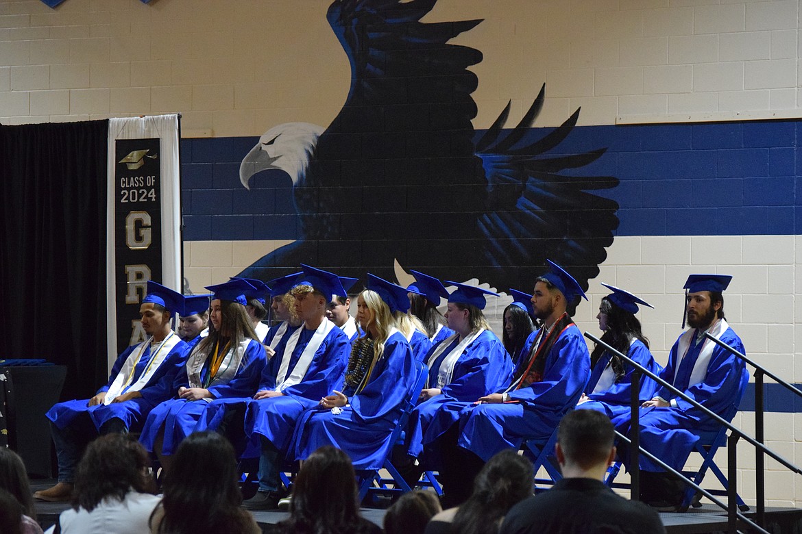 Soap Lake’s Class of 2024 sits on the stage as speakers pass on their advice and hopes for their future.