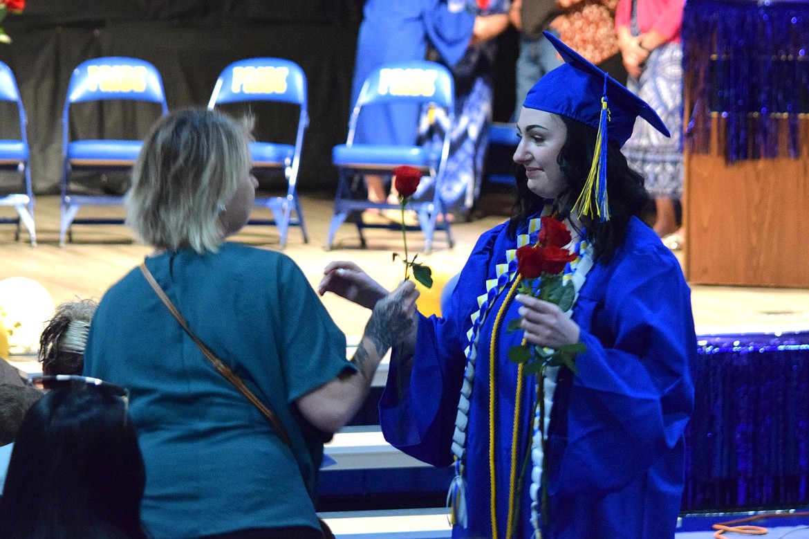 Part of the family and friends tribute during Saturday’s Wilson Creek 2024 graduation ceremony, which is put on by the graduating class themselves, is to give out roses to loved ones in the audience.