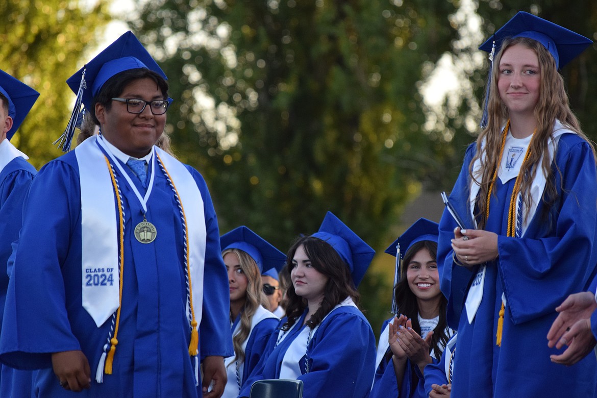 Santiago Herrera Bautista, an honors graduate, marches across the stage to collect his diploma and take the next steps into adulthood.