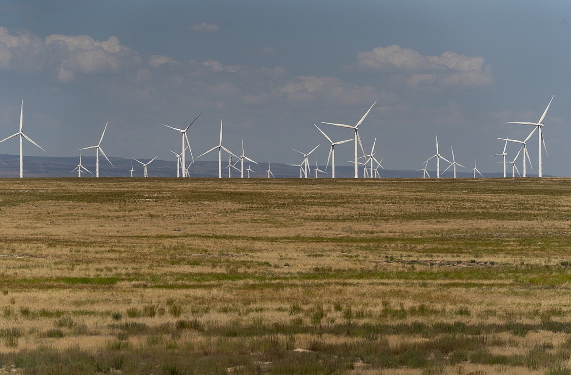 Wind turbines are seen from Interstate-84, July 9, 2023, near Hammett, Idaho. The federal Bureau of Land Management’s preferred alternative for a proposed large-scale wind energy farm in southern Idaho would shrink its size by nearly half and move it farther from a national historic site. (AP Photo/Lindsey Wasson, File)