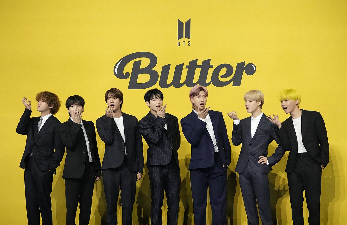 Members of South Korean K-pop band BTS, V, SUGA, JIN, Jung Kook, RM, Jimin, and j-hope from left to right, pose for photographers ahead of a press conference to introduce their new single "Butter" in Seoul, South Korea, Friday, May 21, 2021. South Korea has recently retaliated for North Korea's trash-carrying balloon launches with propaganda loudspeaker broadcasts at border areas. The South Korean broadcasts reportedly included K-pop sensation BTS’s mega hits like “Butter” and “Dynamite,” weather forecasts and news on Samsung as well as outside criticism on the North’s missile program. (AP Photo/Lee Jin-man, File)