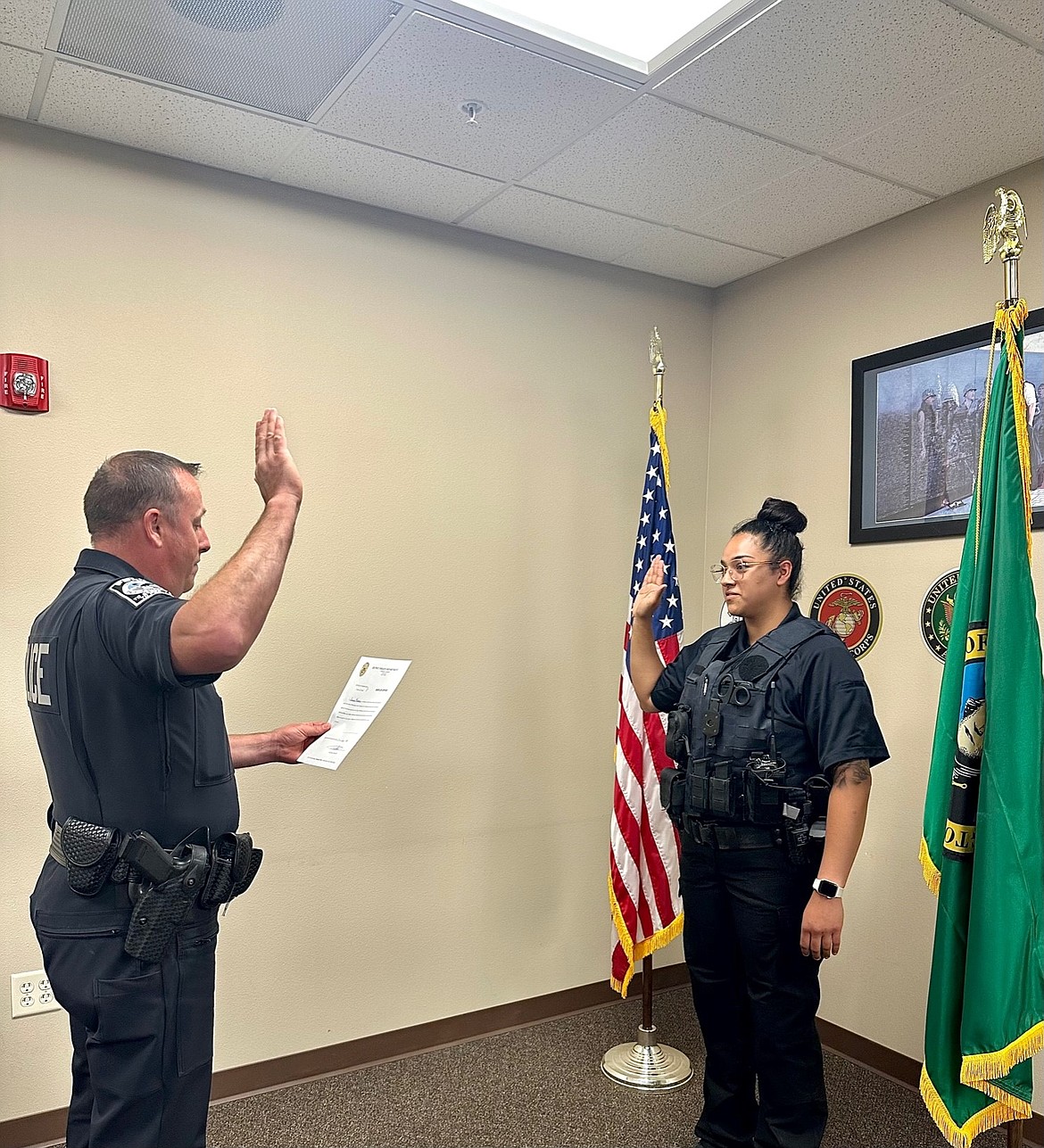 Danya Mercado, right, is sworn in Tuesday as the Quincy Police Department’s newest officer.