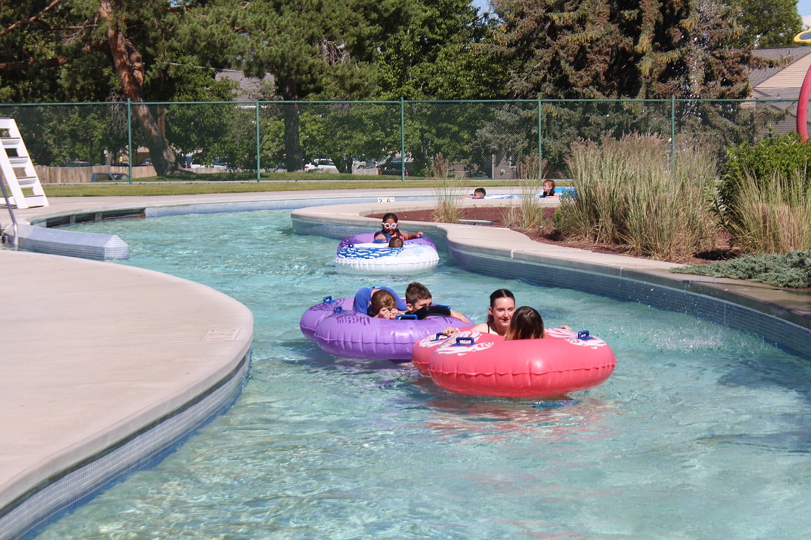 Swimmers cruise the Lazy River at the Surf ‘n Slide water park Tuesday in Moses lake. Summer is here, and local pools are open to prove it.