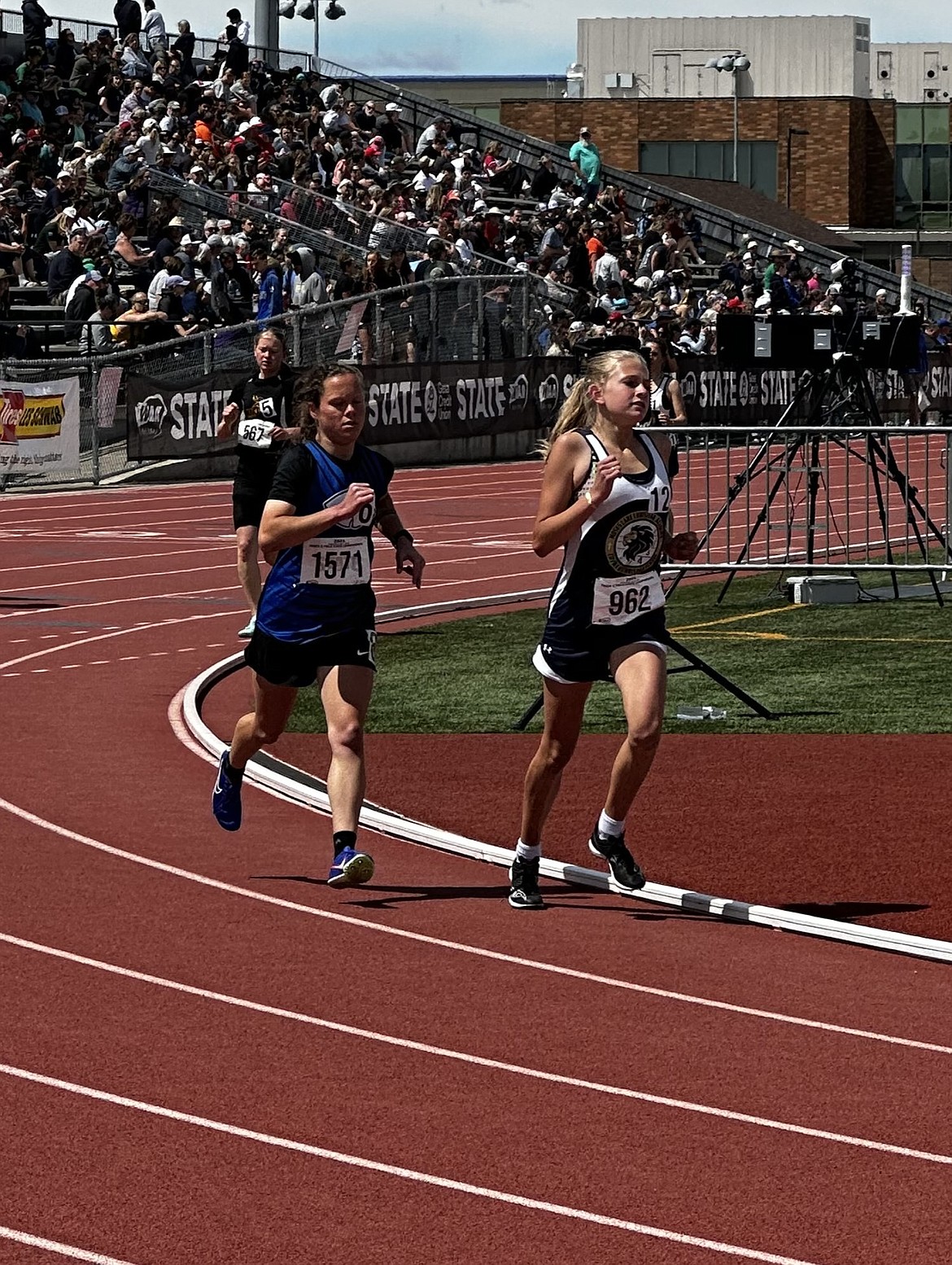 MLCA/CCS eighth-grader Rebecca Wiser, right, runs at the 1B State Track and Field Championships in Yakima. Wiser ran in three events at the meet; the 1,600-meter run, the 3,200-meter run and the second leg of the 4x100-meter relay.