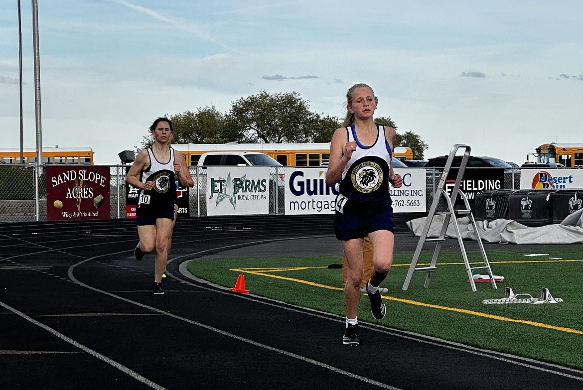 MLCA/CCS eighth-grader Rebecca Wiser, right, and sophomore Brynlynn King, left, run at the Vanderholm Memorial Invitational at Royal High School on May 3. Wiser said that King was the reason she signed up to run track this spring.