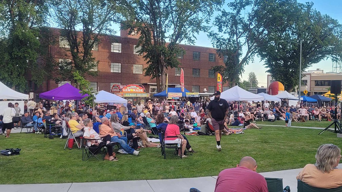 A crowd listens to live music on the front lawn of the Grant County Courthouse while vendor booths line C Street between the courthouse and the Bureau of Reclamation Building. Long-time Ephrata residents and visitors from across the region came to enjoy good music, good food and good company.
