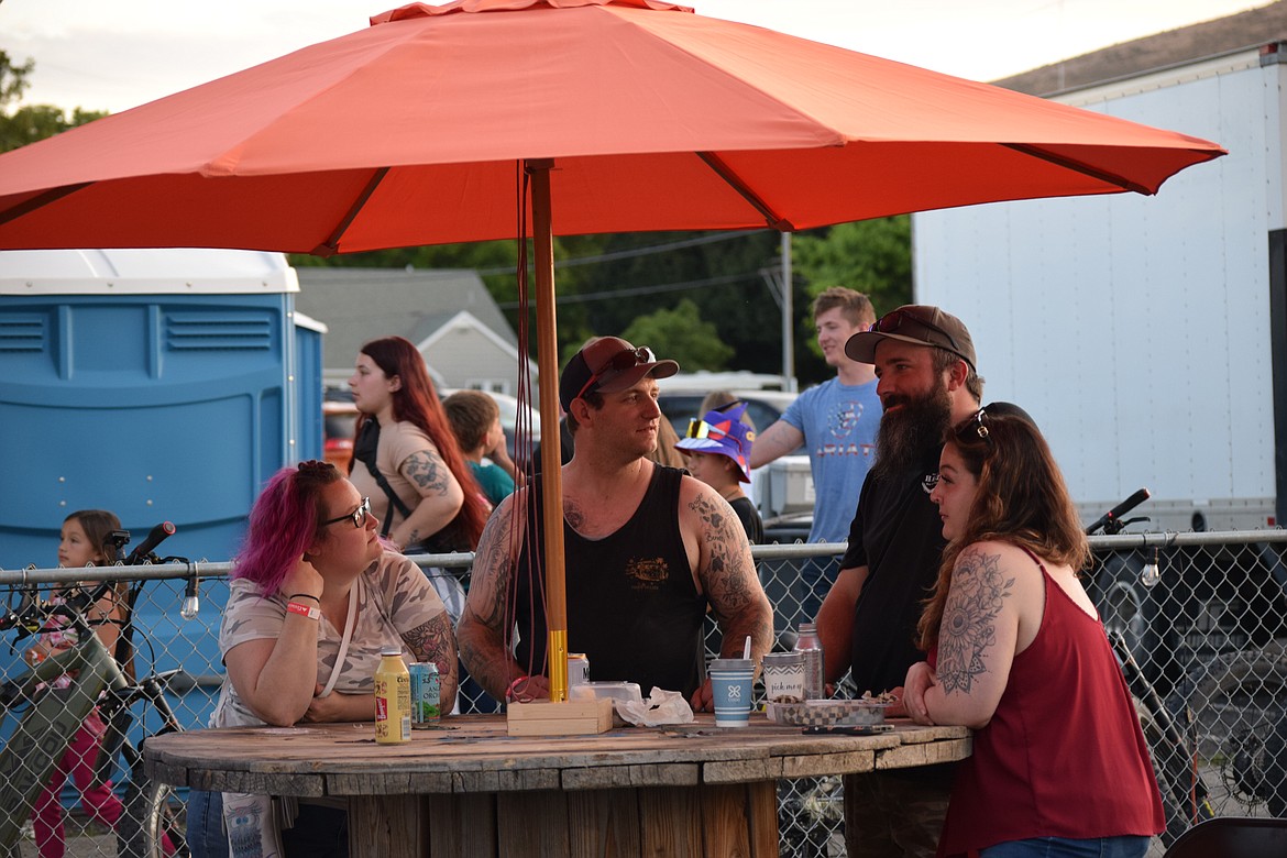 Friends gather in the beer garden for some shade, an adult beverage and a few laughs during this year’s Sage-N-Sun festival.