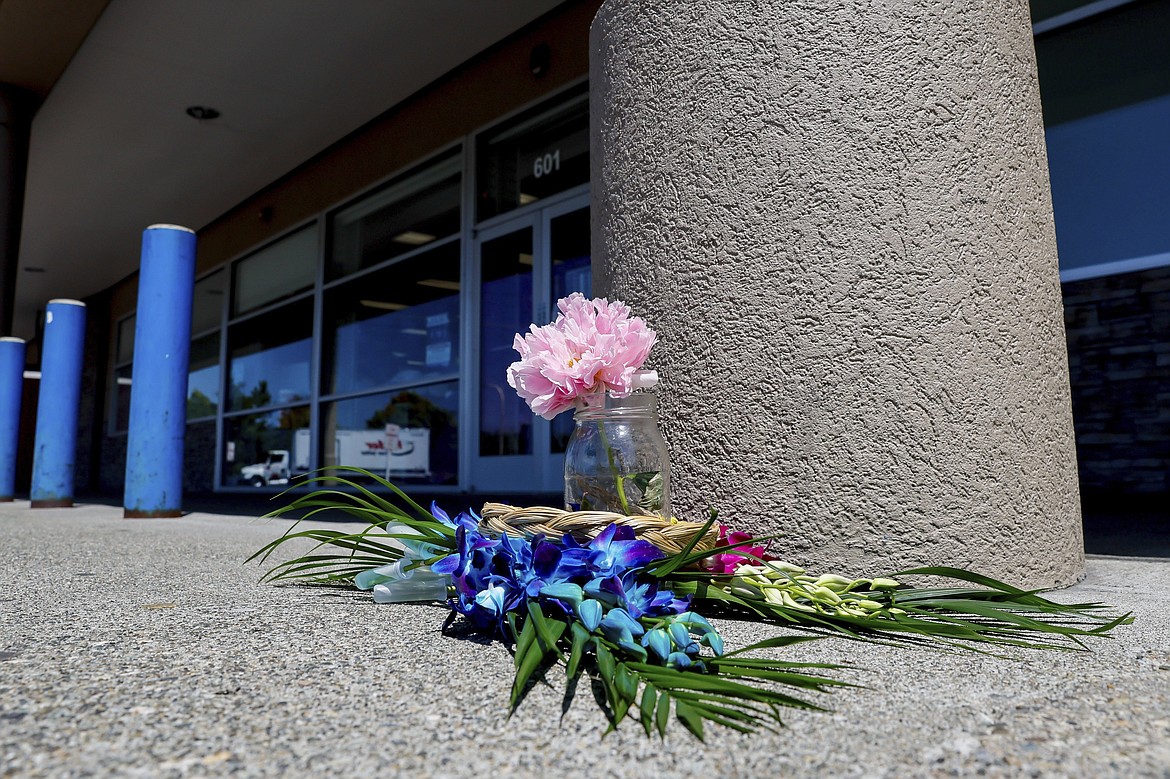 A small memorial is seen outside a Big 5 Sporting Goods store after 17-year-old Hazrat Ali Rohani was shot and killed on Wednesday June, 5, 2024, in Renton, Wa. (Jennifer Buchanan/The Seattle Times via AP)