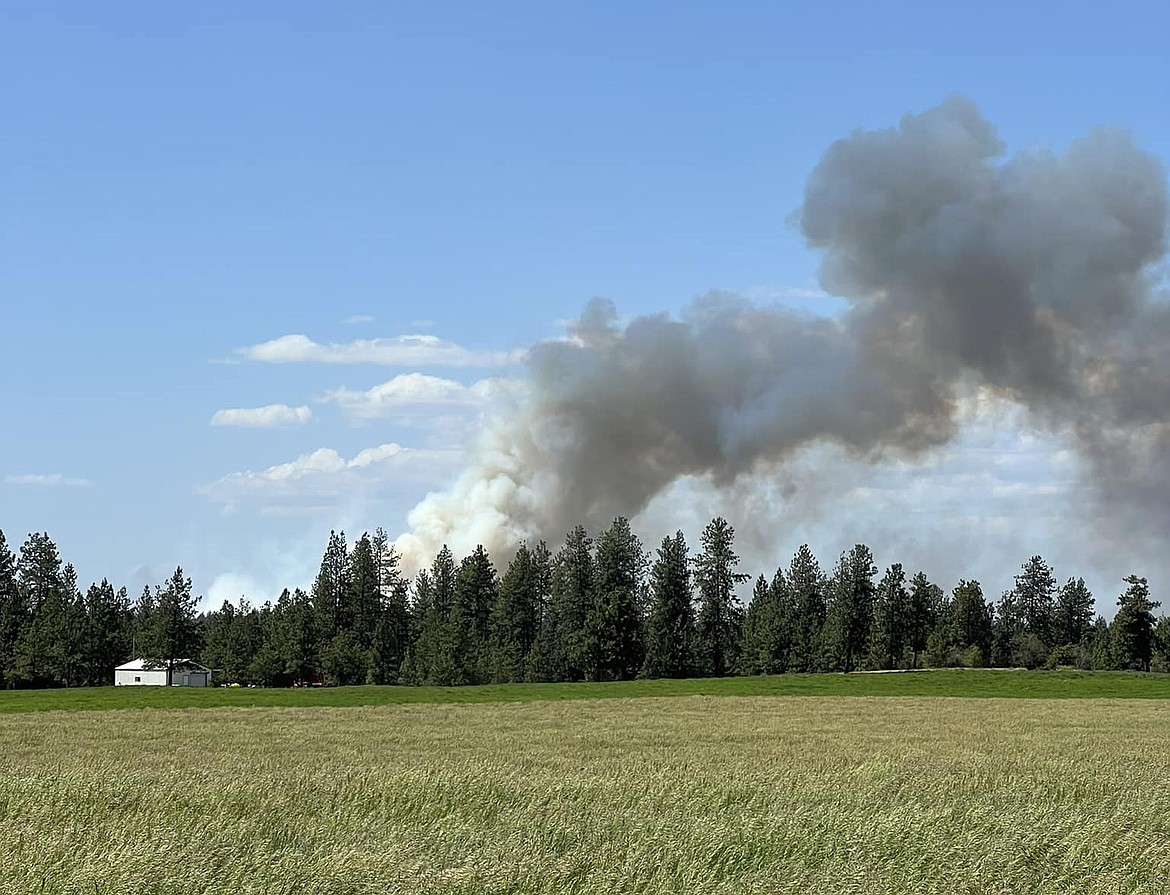 All evacuation orders for the Grove Fire, which sprang up west of Spokane Tuesday, have been downgraded.