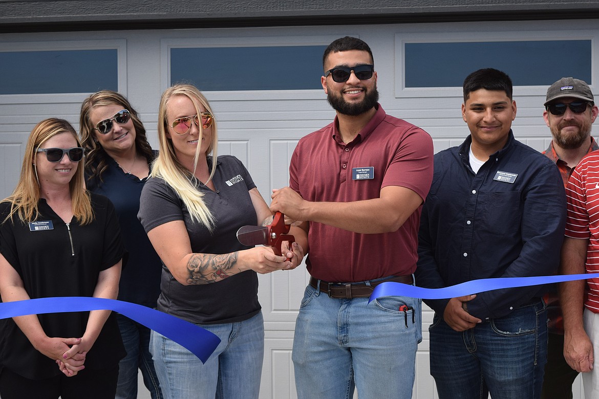 Representatives of Hayden Homes and the organization’s project managers in Moses Lake cut the ribbon on the newly constructed model home in the Polo Ridge area of Moses Lake June 6.