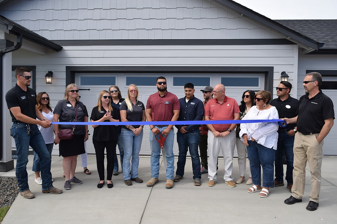 Moses Lake city officials, real estate representatives, Hayden Homes staff and representatives from the Moses Lake Chamber of Commerce attended the June 6 ribbon-cutting ceremony for a new model home in Moses Lake’s newer Polo Ridge housing community.